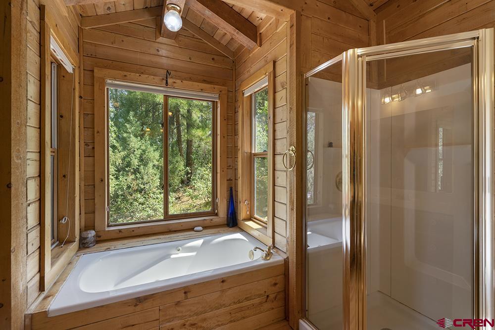 154 N Road Durango, CO 81303 - Photo 23 of 35 a bathroom with a granite countertop sink and shower