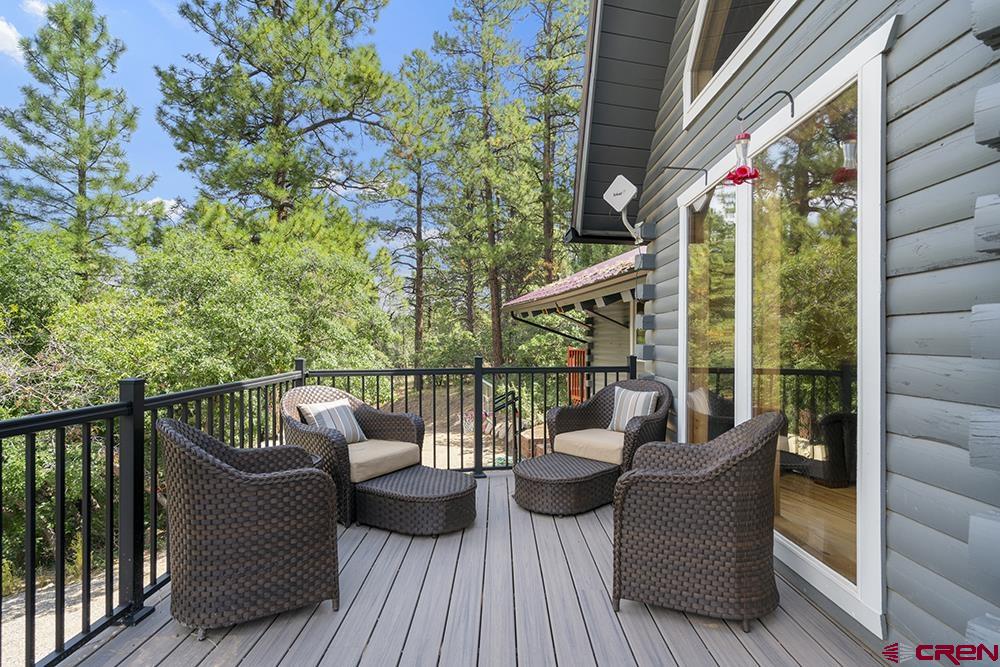 154 N Road Durango, CO 81303 - Photo 31 of 35 a view of a deck with furniture and wooden floor