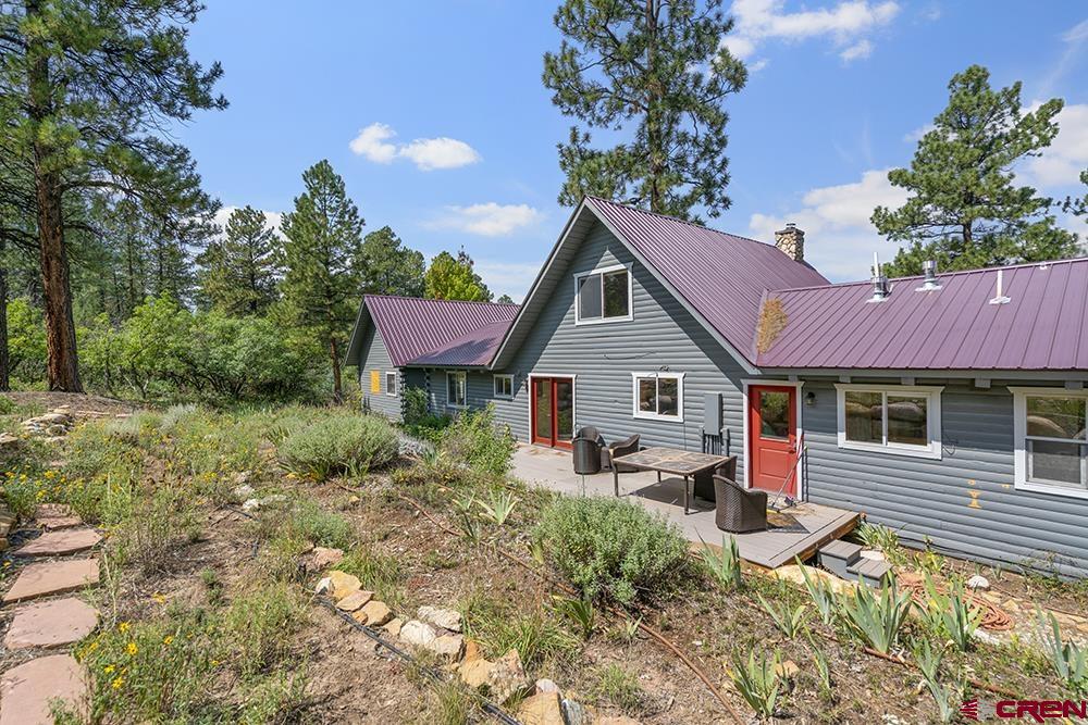 154 N Road Durango, CO 81303 - Photo 32 of 35 a view of a house with a yard