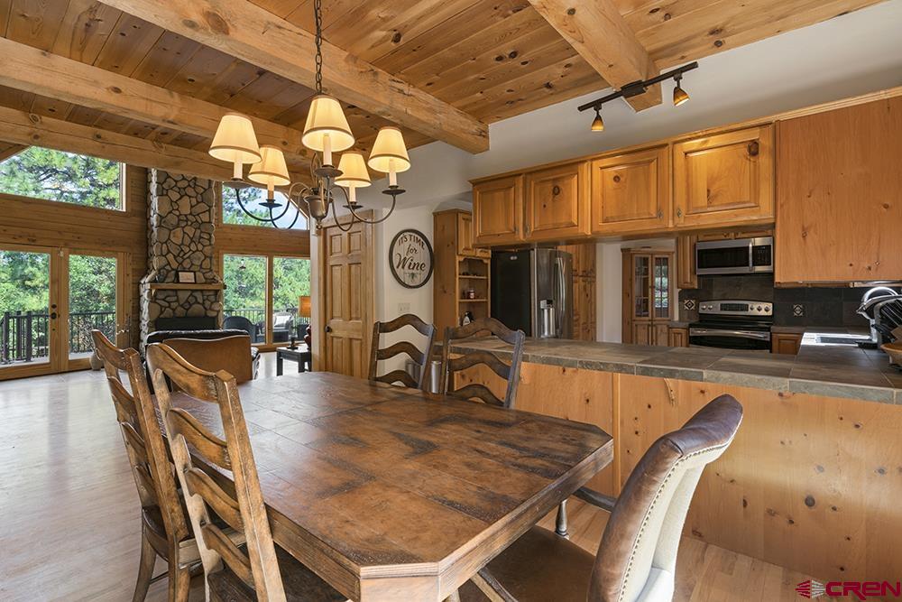 154 N Road Durango, CO 81303 - Photo 10 of 35 a dining room with a large window and table