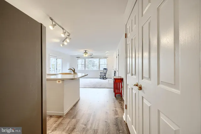 an empty room with windows and closet