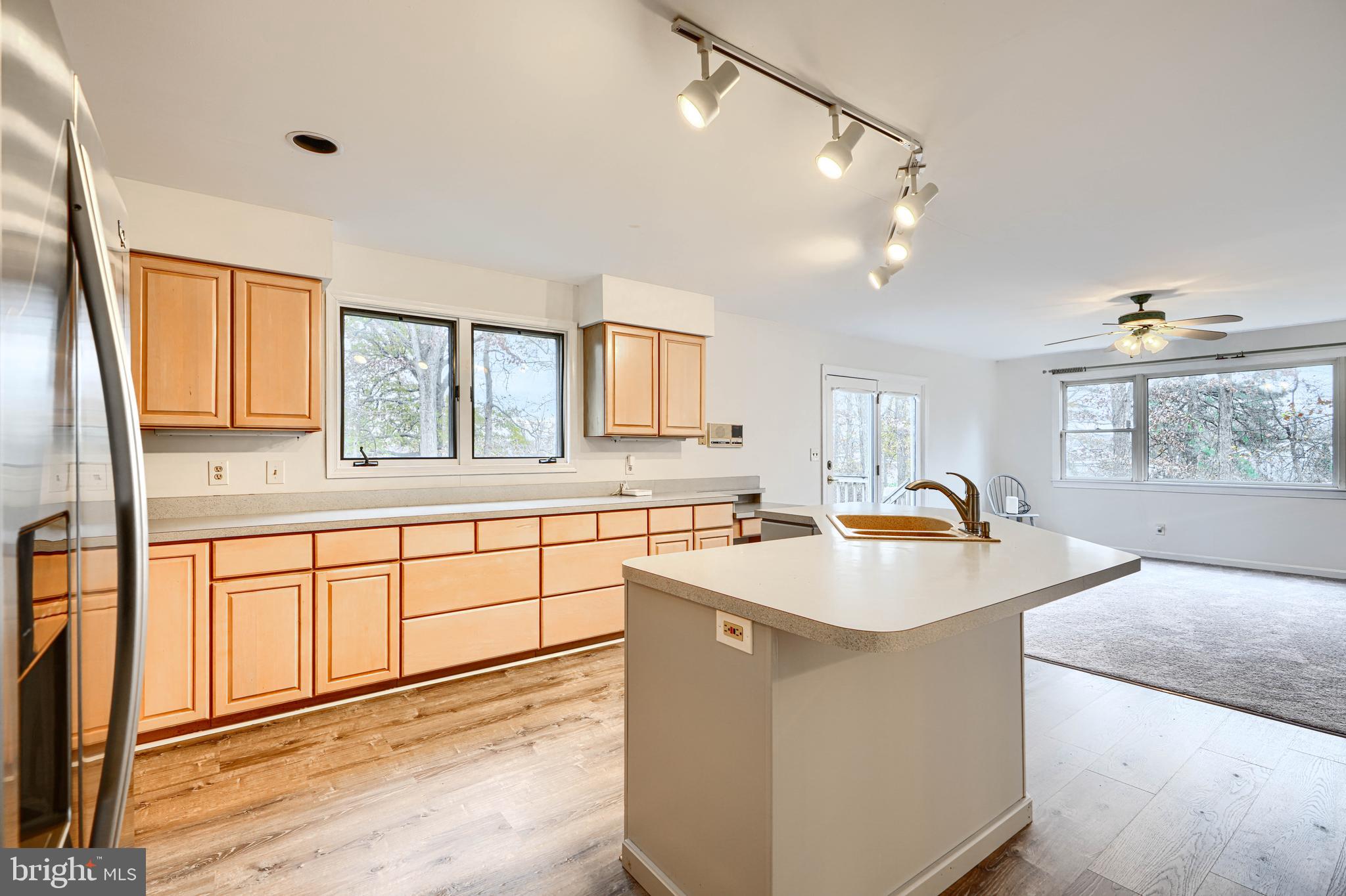 2508 Perring Woods Road Baltimore, MD 21234 - Photo 12 of 42 a kitchen with granite countertop a sink and a refrigerator