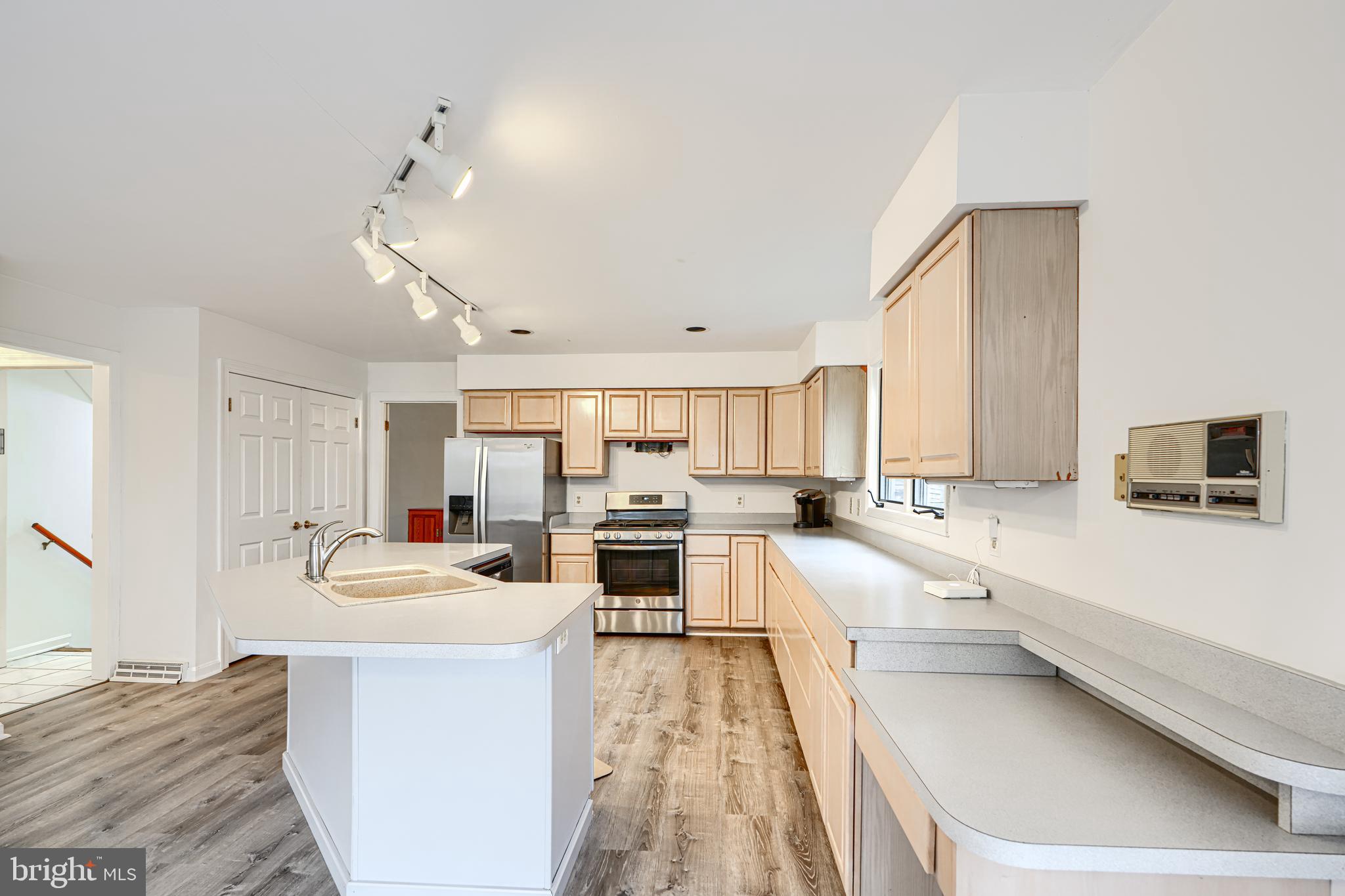 2508 Perring Woods Road Baltimore, MD 21234 - Photo 15 of 42 a kitchen with counter top space cabinets and appliances