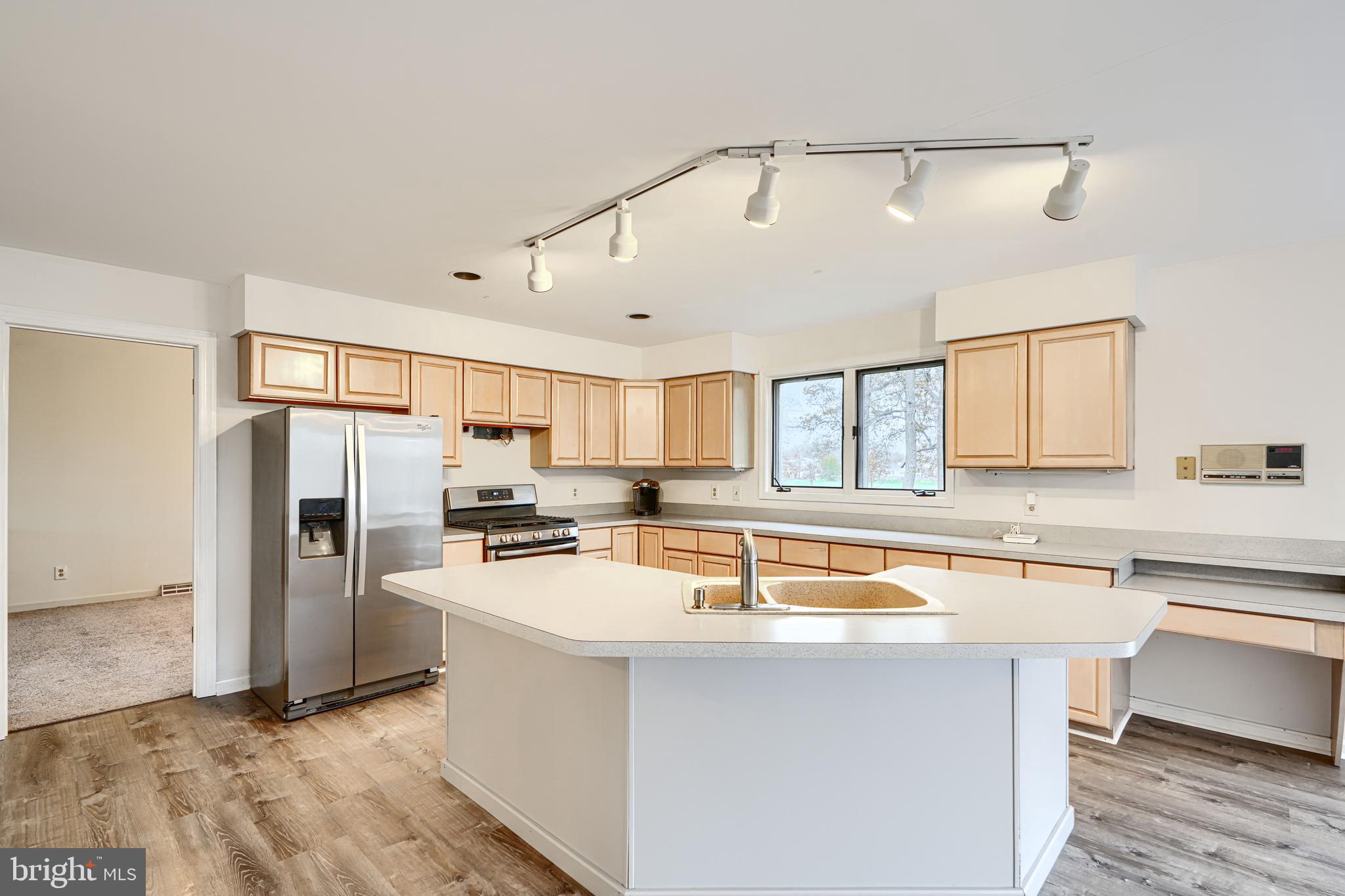 2508 Perring Woods Road Baltimore, MD 21234 - Photo 16 of 42 a kitchen with refrigerator cabinets and a sink