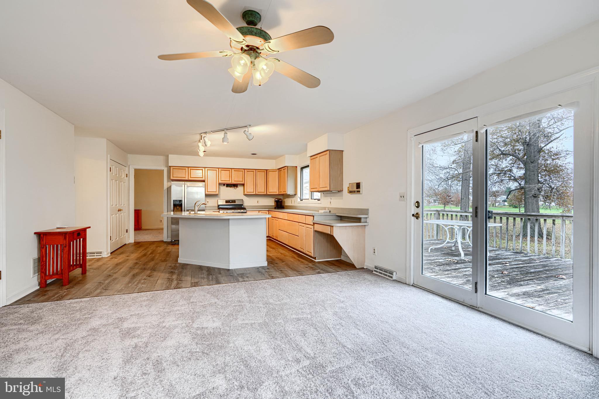 2508 Perring Woods Road Baltimore, MD 21234 - Photo 20 of 42 a large kitchen with kitchen island a stove a sink and a refrigerator