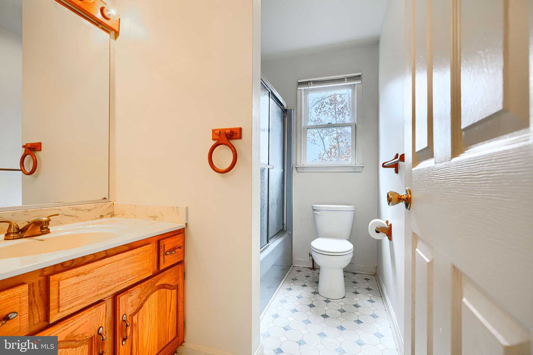 2508 Perring Woods Road Baltimore, MD 21234 - Photo 27 of 42 a bathroom with a sink toilet and a mirror