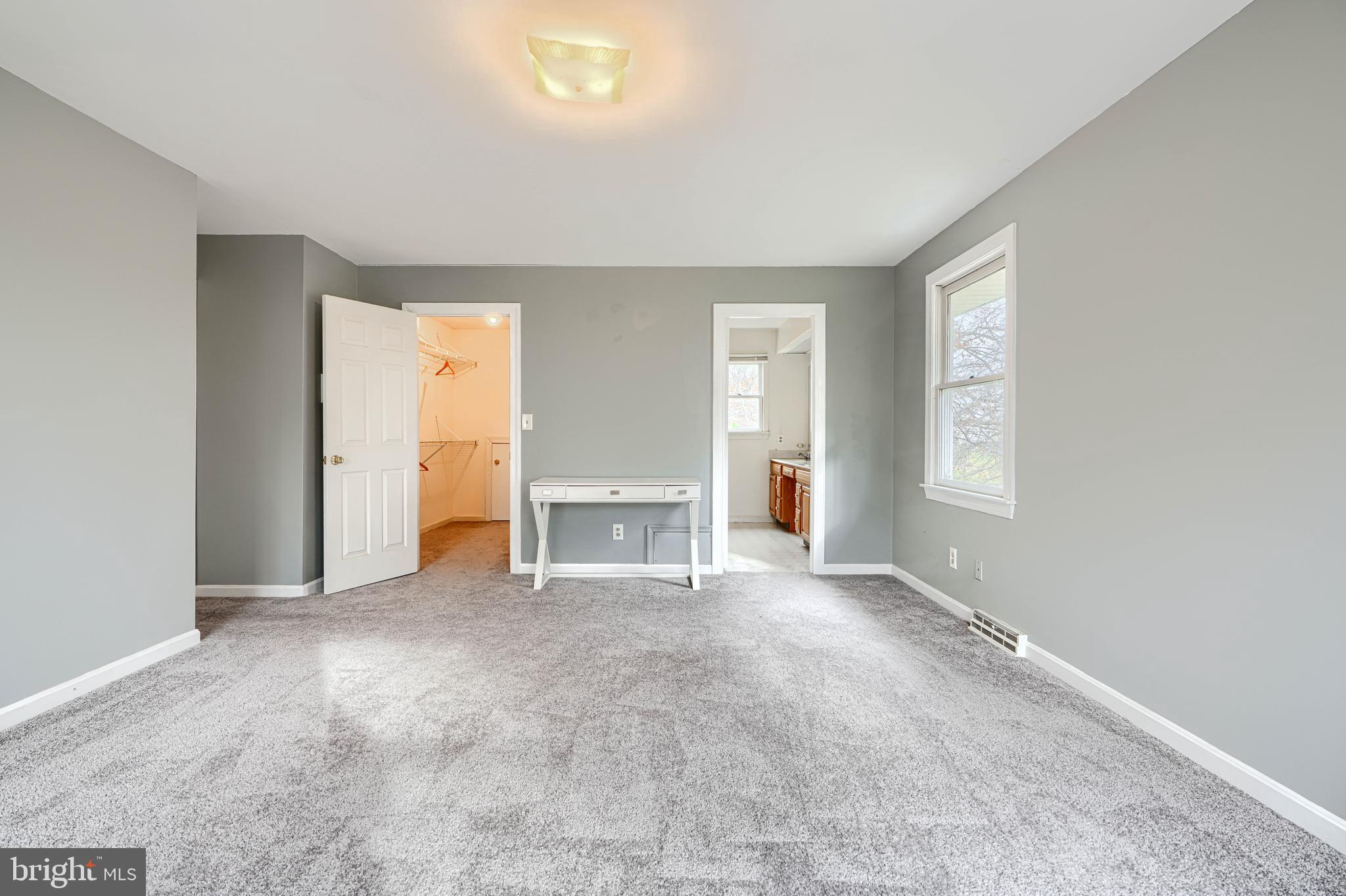 2508 Perring Woods Road Baltimore, MD 21234 - Photo 32 of 42 an empty room with windows and closet