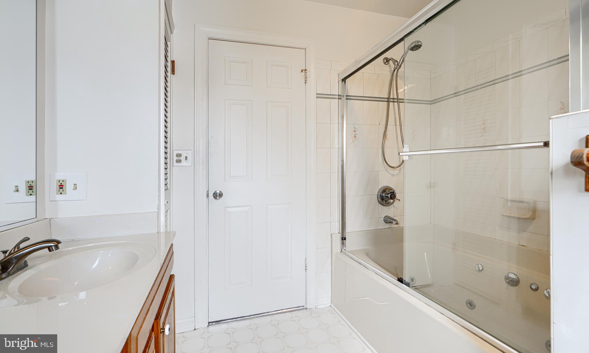 2508 Perring Woods Road Baltimore, MD 21234 - Photo 37 of 42 a bathroom with a tub a sink and a shower