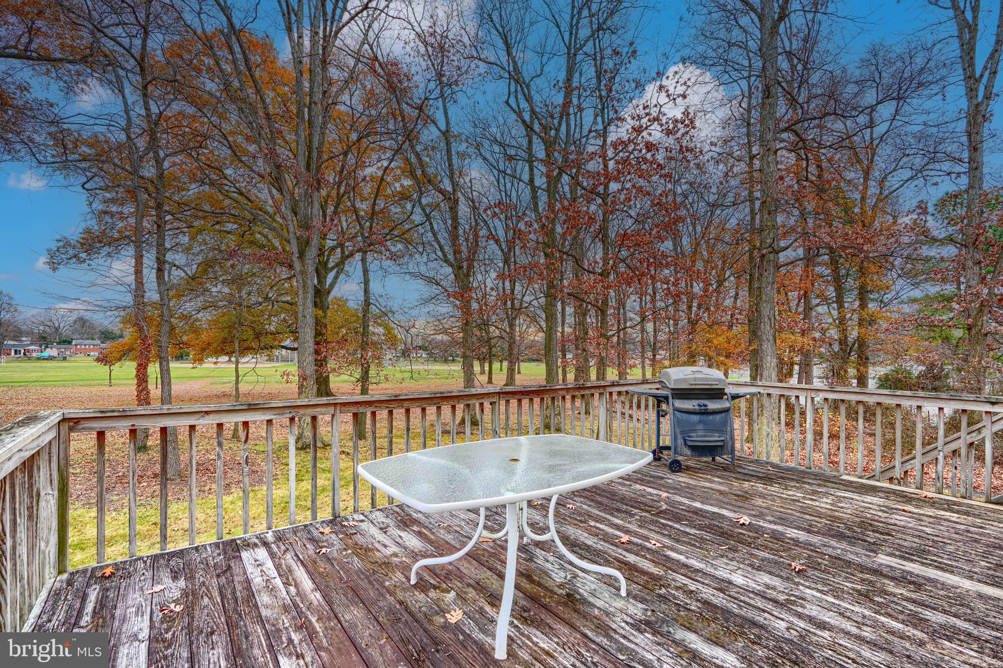 2508 Perring Woods Road Baltimore, MD 21234 - Photo 38 of 42 a view of a roof deck with wooden floor and fence