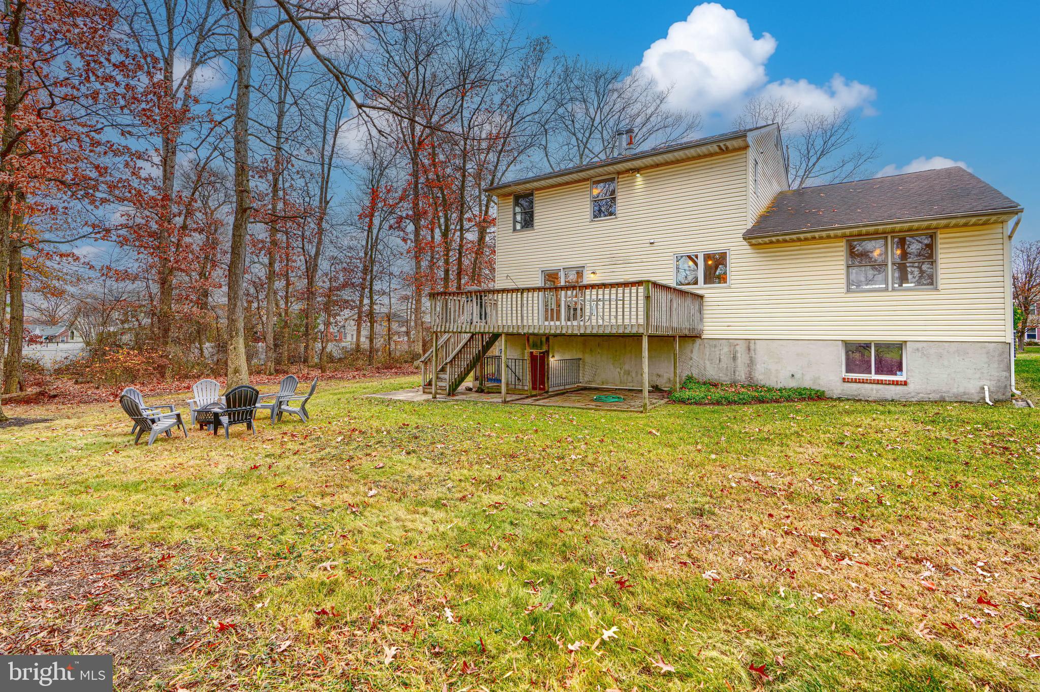 2508 Perring Woods Road Baltimore, MD 21234 - Photo 42 of 42 a view of a house with a yard patio and fire pit