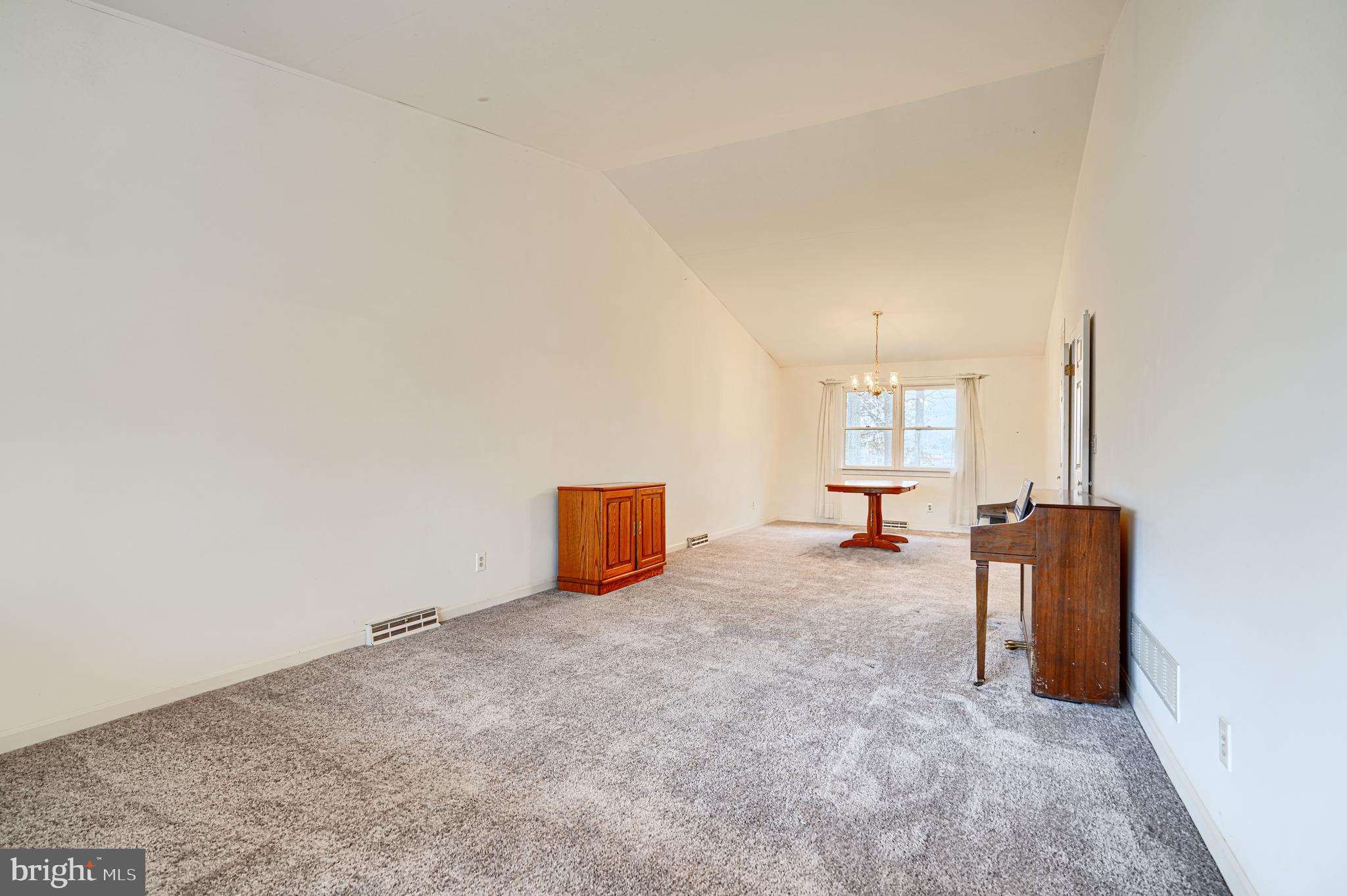 2508 Perring Woods Road Baltimore, MD 21234 - Photo 7 of 42 an empty room with windows