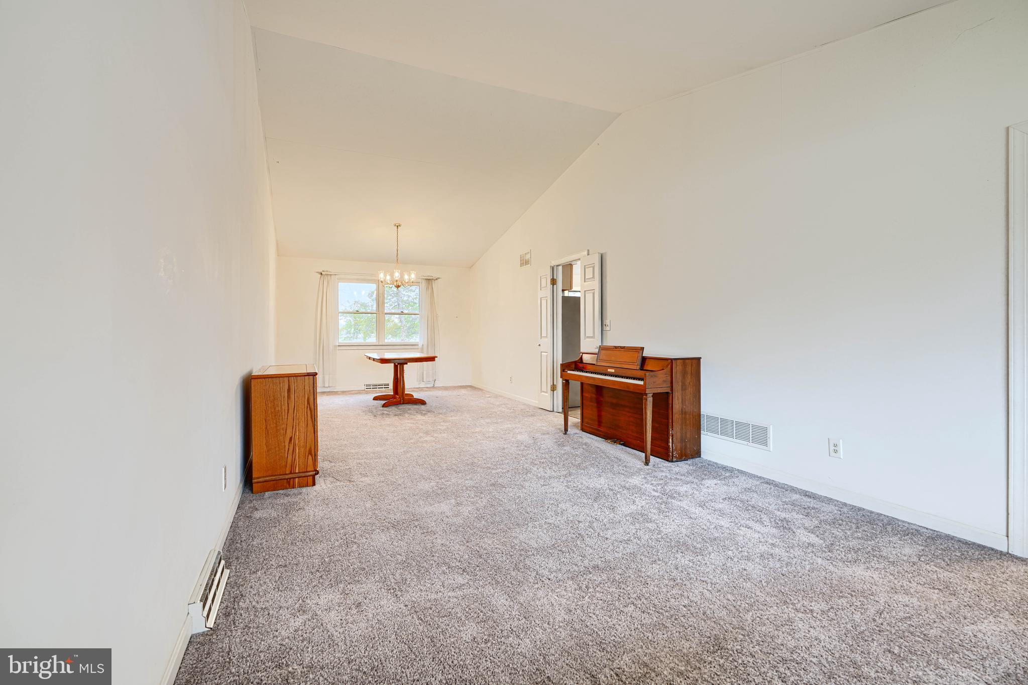 2508 Perring Woods Road Baltimore, MD 21234 - Photo 8 of 42 an empty room with windows