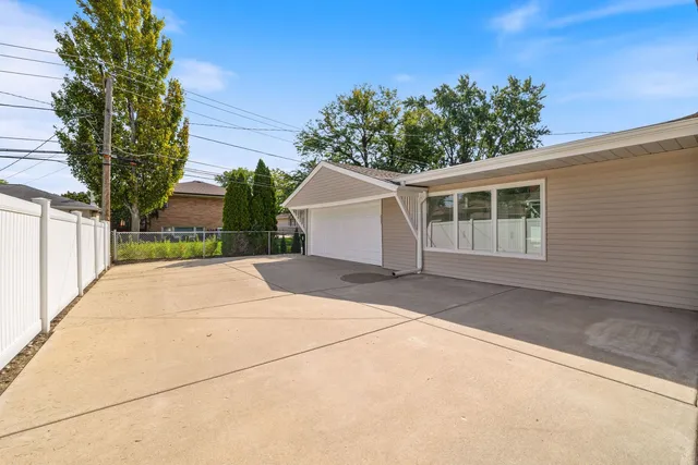 a view of garage and yard