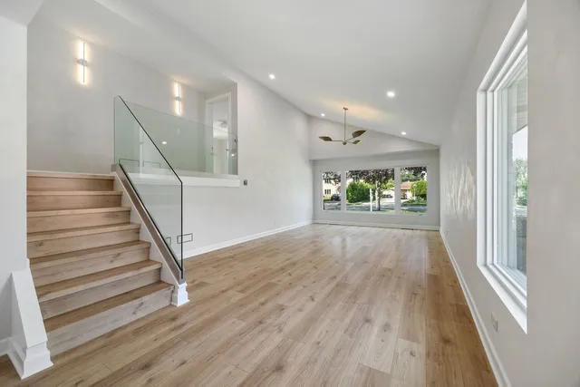 a view of entryway with wooden floor and window