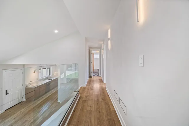 a view of a kitchen from the hallway