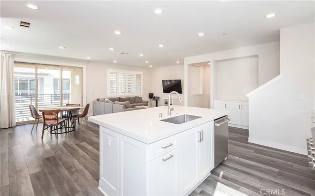 a view of kitchen with cabinets and wooden floor