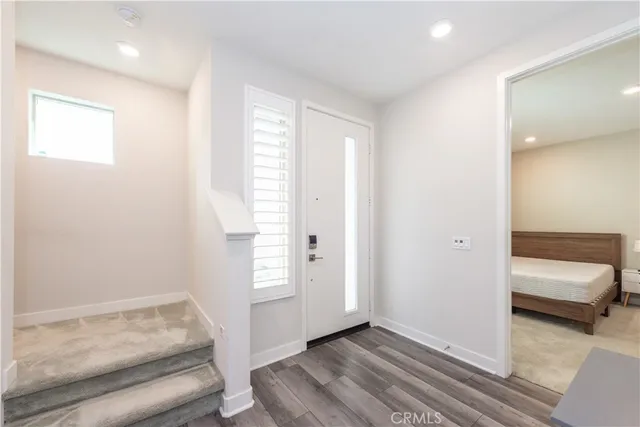 a hallway with a couch and a window