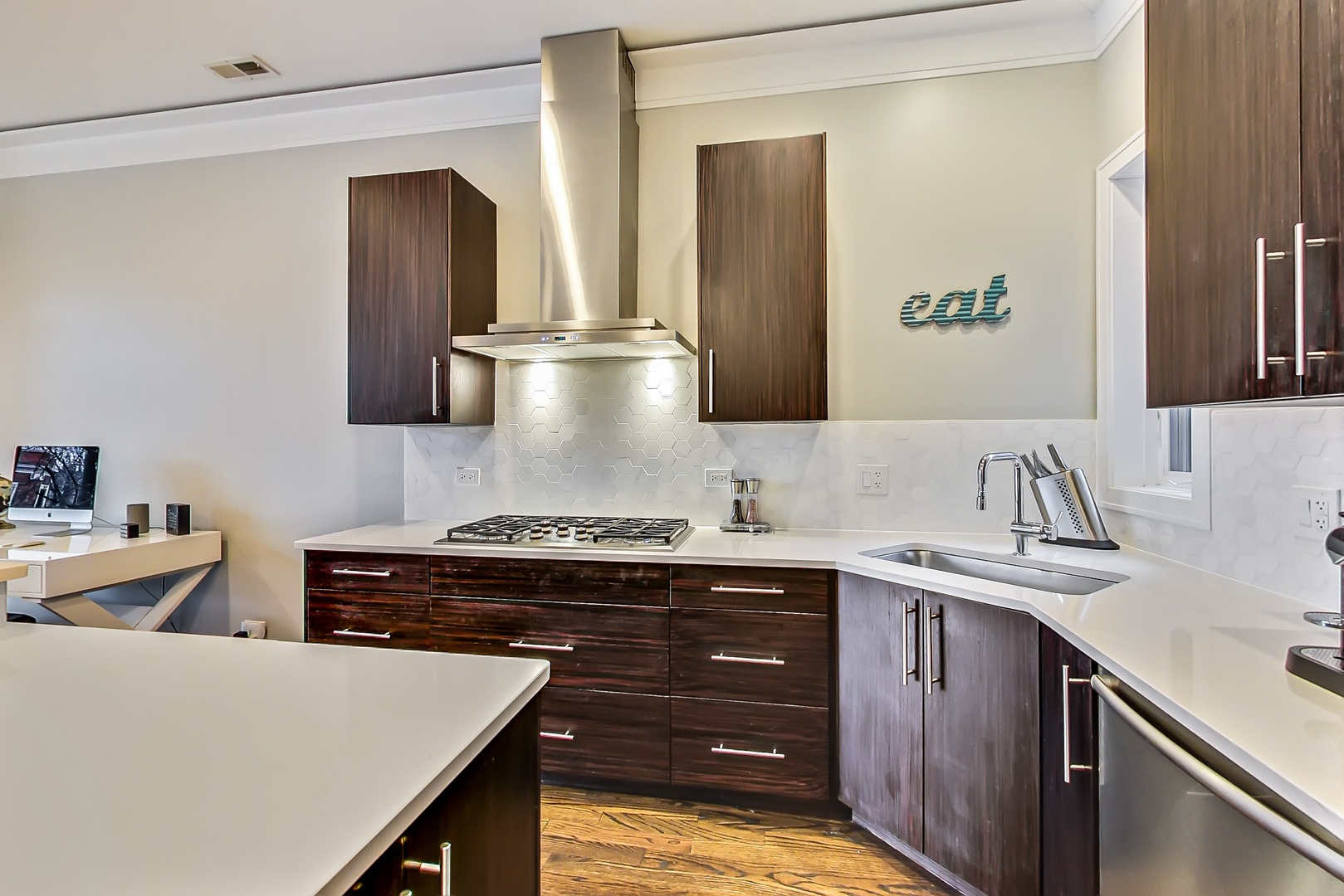 2121 West Roscoe Street, Unit 2 Chicago, IL 60618 - Photo 11 of 24 a kitchen with stainless steel appliances granite countertop a sink stove and cabinets