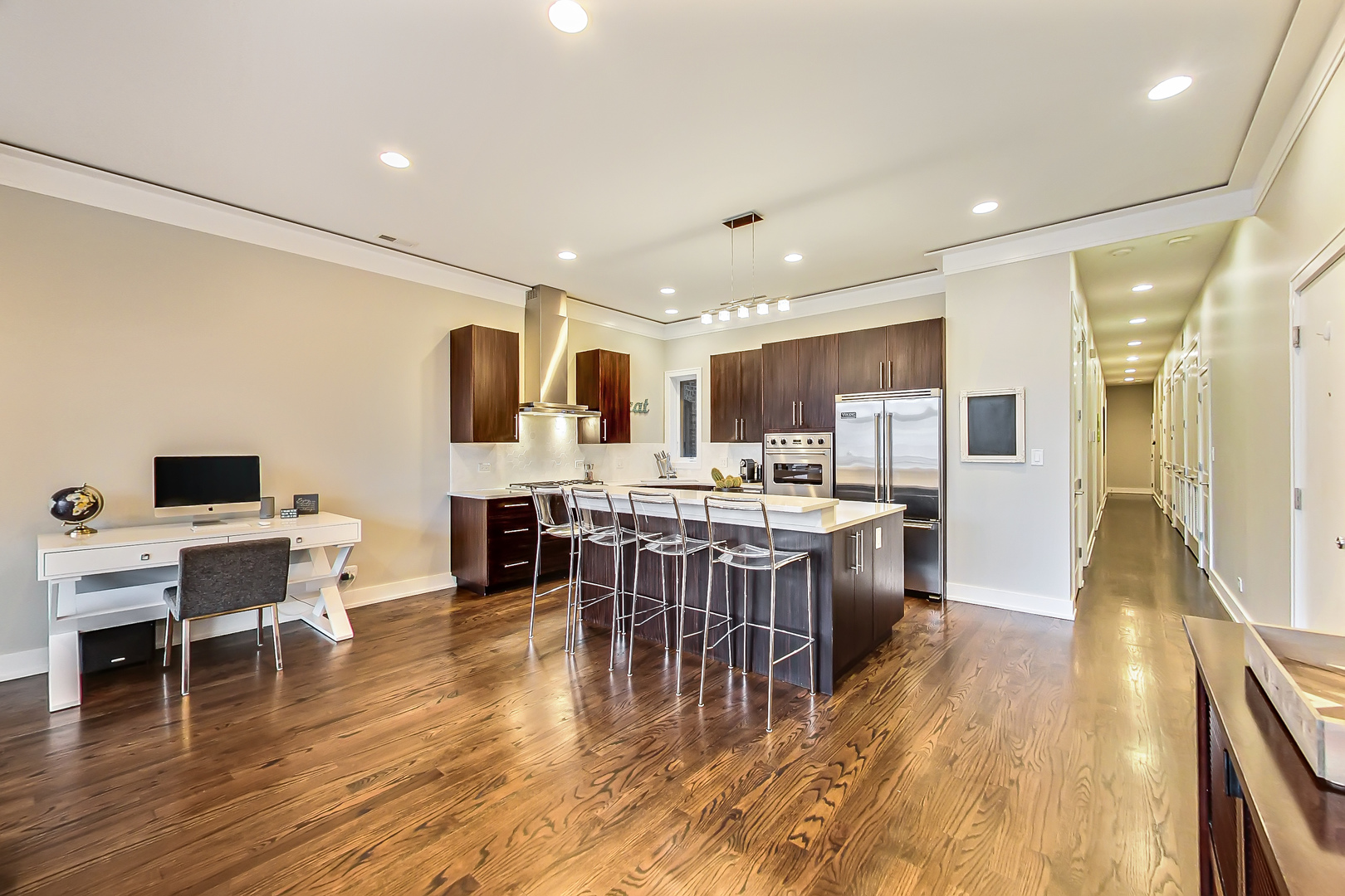 2121 West Roscoe Street, Unit 2 Chicago, IL 60618 - Photo 12 of 24 a large kitchen with a table and chairs in it
