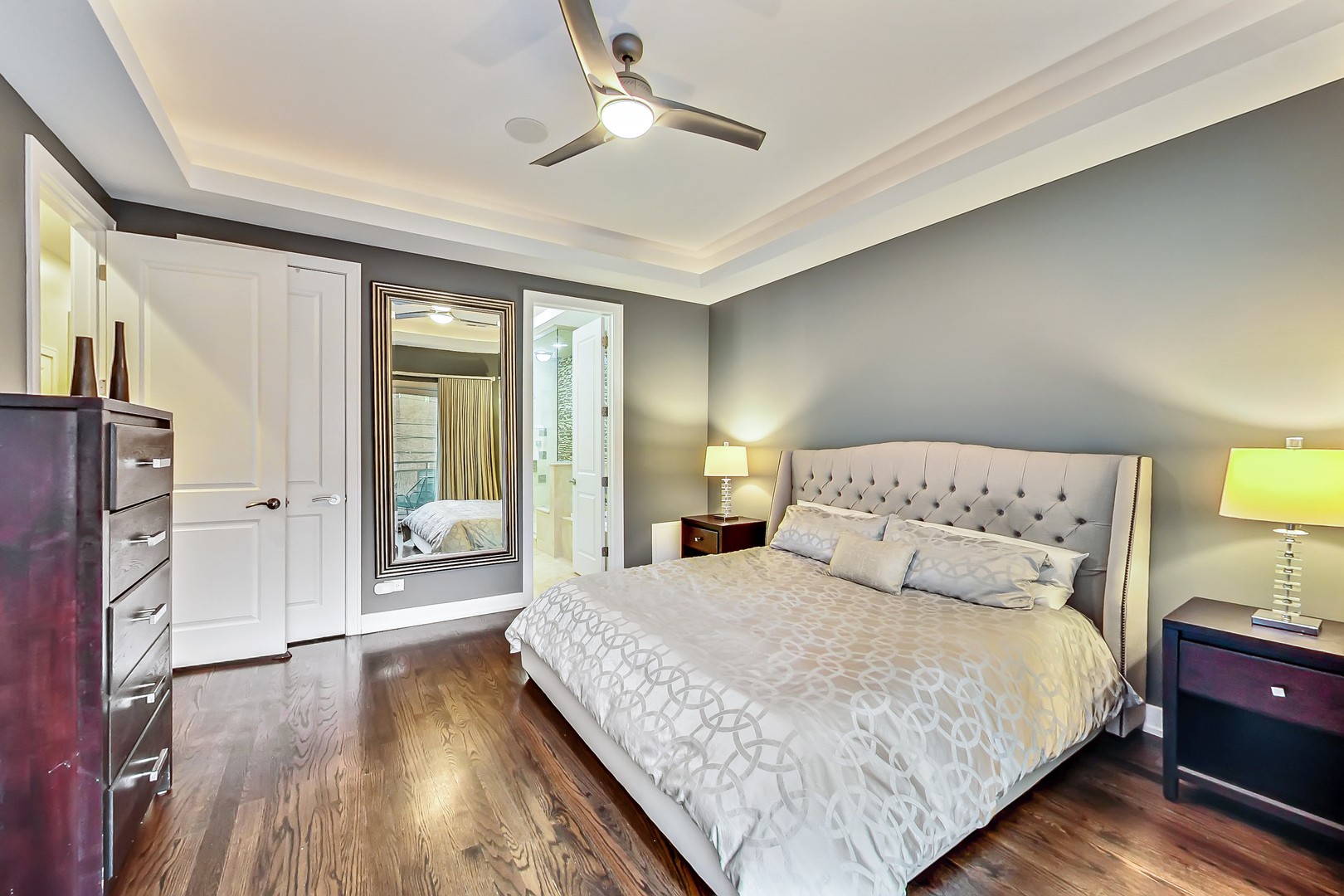 2121 West Roscoe Street, Unit 2 Chicago, IL 60618 - Photo 16 of 24 a bedroom with a large bed and a chandelier