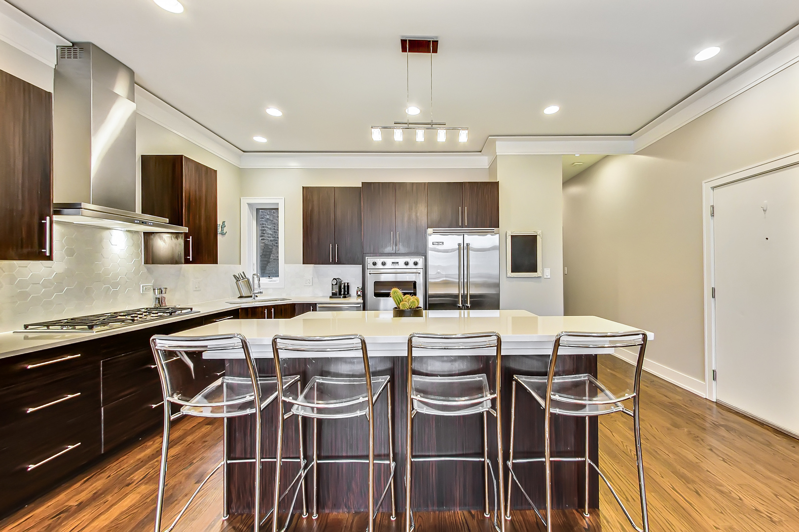 2121 West Roscoe Street, Unit 2 Chicago, IL 60618 - Photo 8 of 24 a large kitchen with a table and chairs