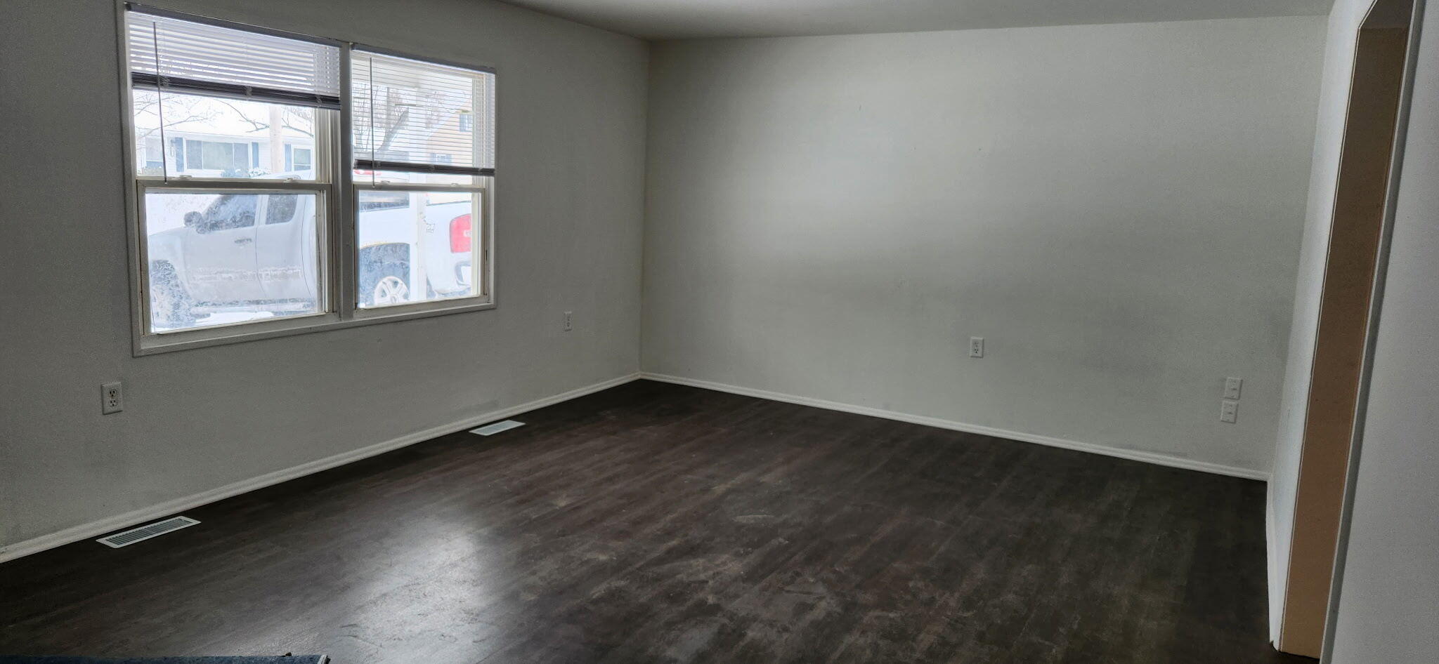 722-1 Capitol Road Valparaiso, IN 46385 - Photo 3 of 12 an empty room with wooden floor and windows