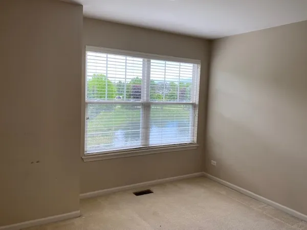 an empty room with closet area