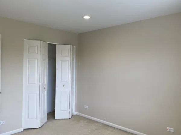 an empty room with large windows