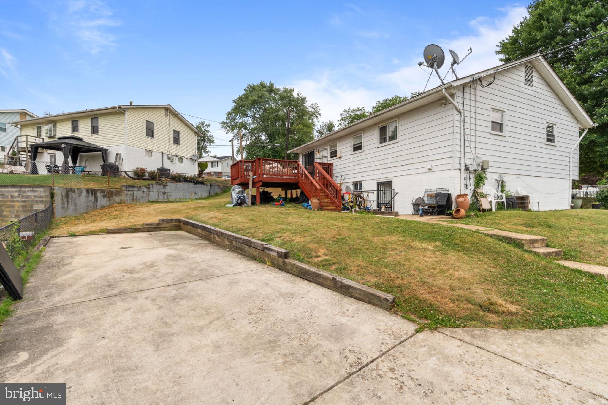 6816 Pepper Street Capitol Heights, MD 20743 - Photo 11 of 12 Spacious backyard with inviting deck.