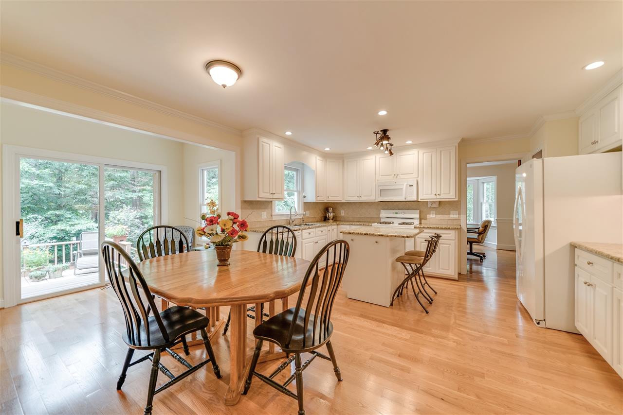 As you can tell, this home is flooded with natural light! Open concept kitchen to break area and sunroom! Kitchen