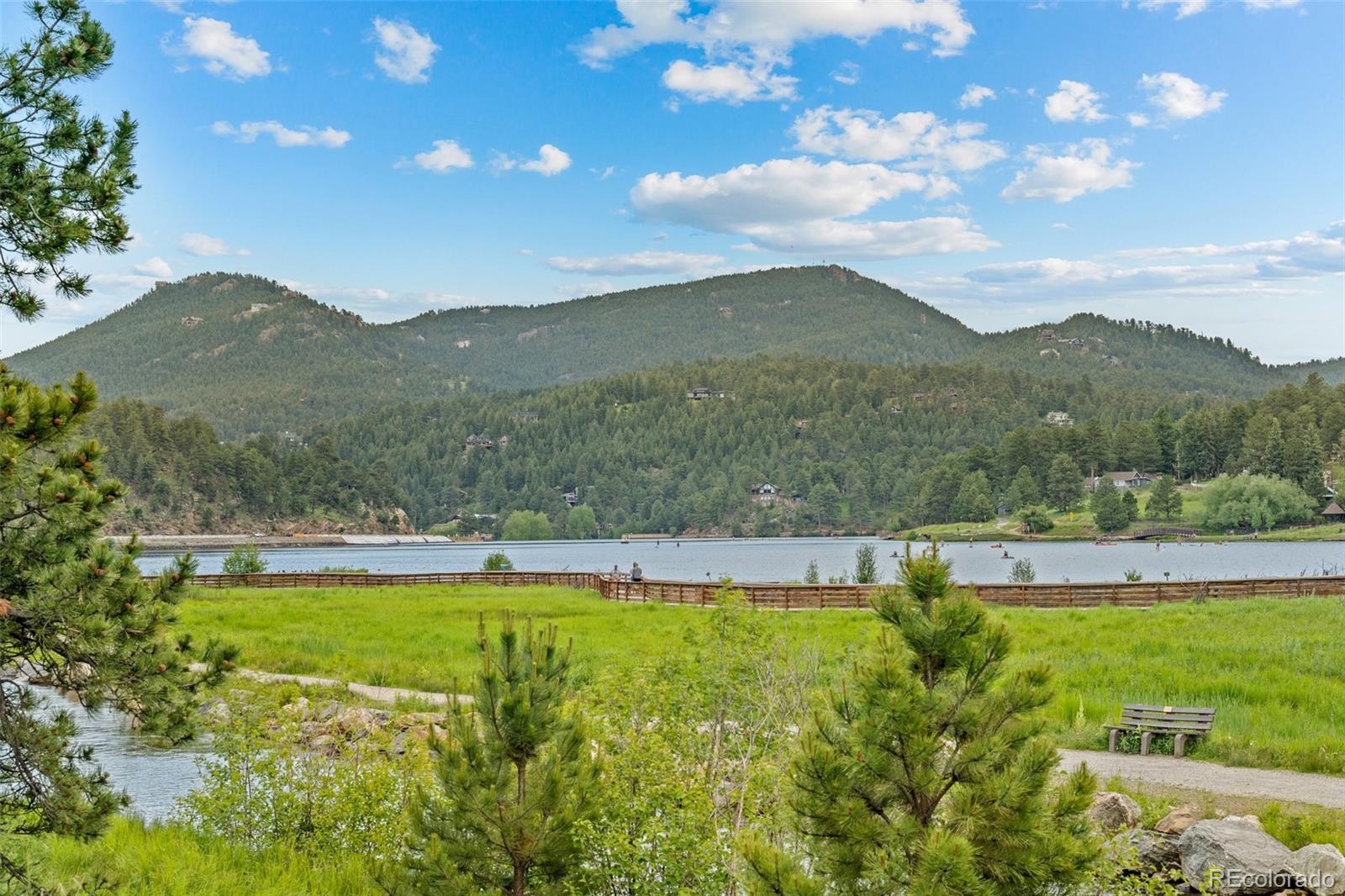 34095 Columbine Circle Evergreen, CO 80439 - Photo 26 of 32 a view of a lake with a mountain in the background