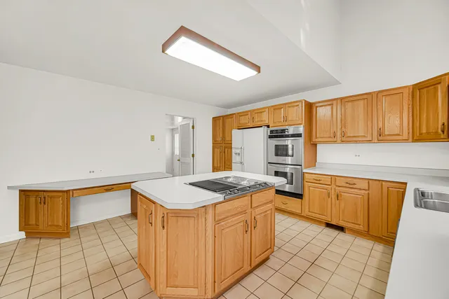 a view of a livingroom with a ceiling fan and window