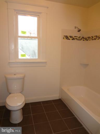 644 Coleraine Road Baltimore, MD 21229 - Photo 3 of 30 a bathroom with a toilet and a shower
