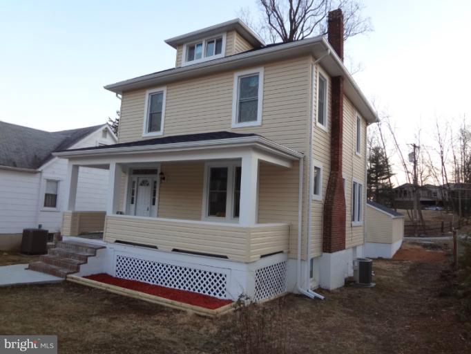 644 Coleraine Road Baltimore, MD 21229 - Photo 22 of 30 a front view of a house with a yard
