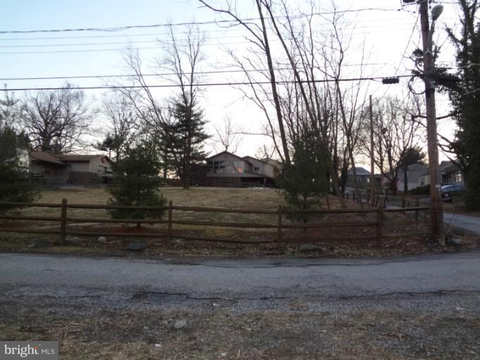 644 Coleraine Road Baltimore, MD 21229 - Photo 5 of 30 a view of backyard with wooden fence and trees