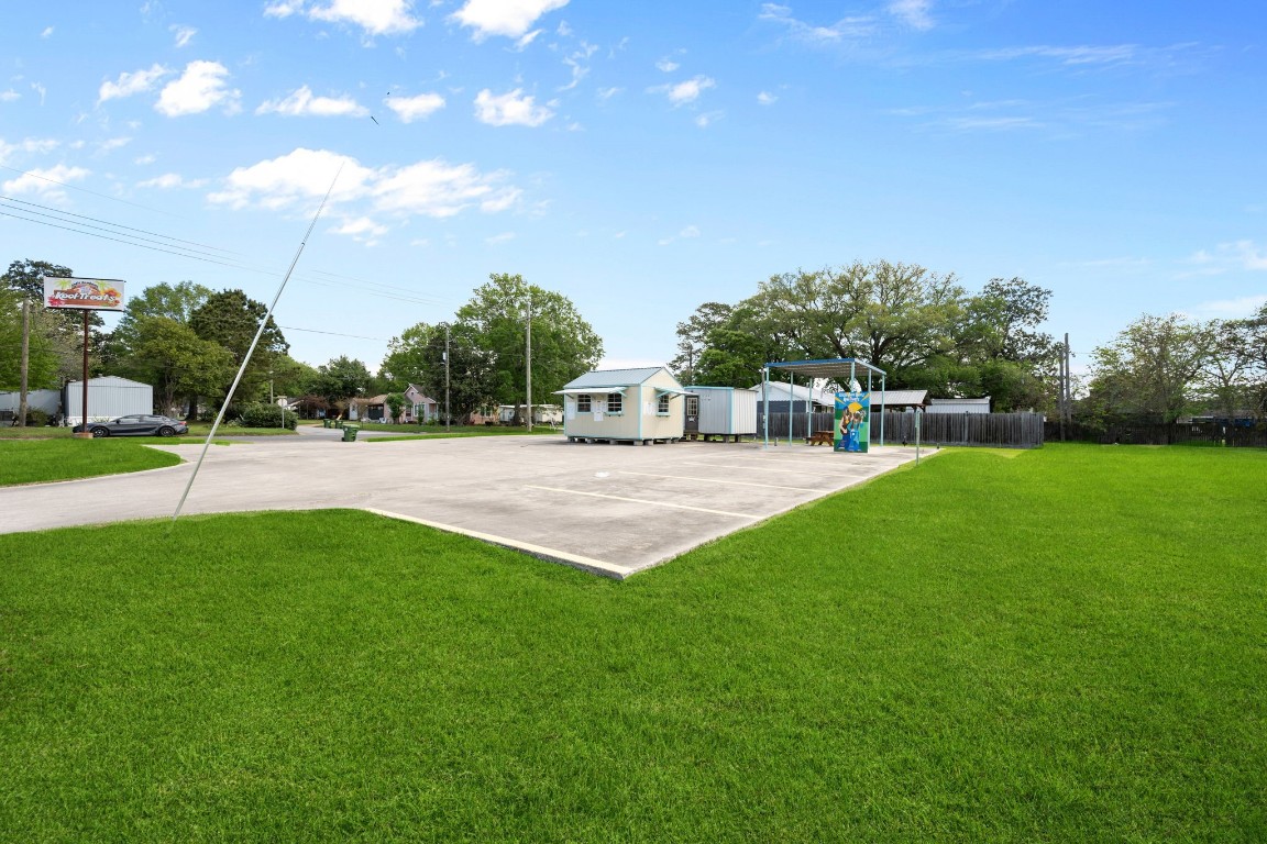 1314 Kipling Street Liberty, TX 77575 - Photo 4 of 18 a view of a house with a backyard