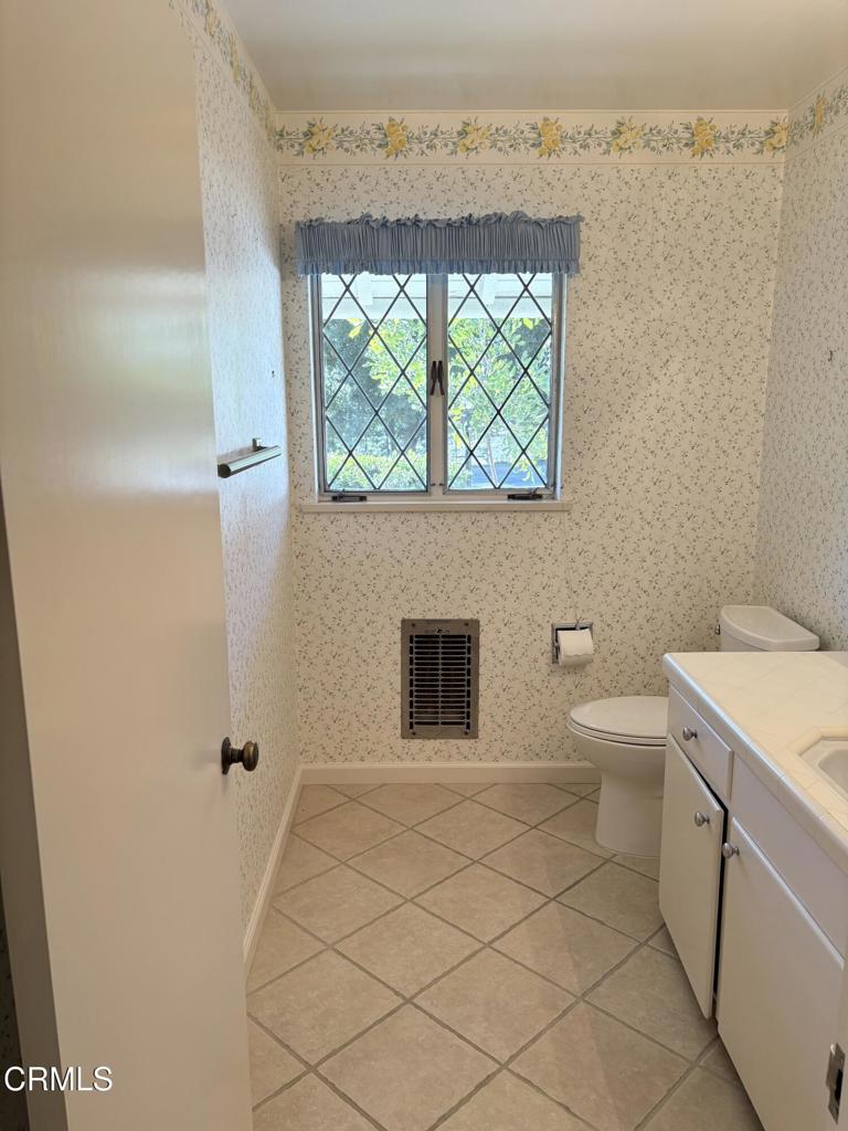 1920 North Altadena Drive Pasadena, CA 91107 - Photo 14 of 25 a bathroom with a toilet a sink and mirror