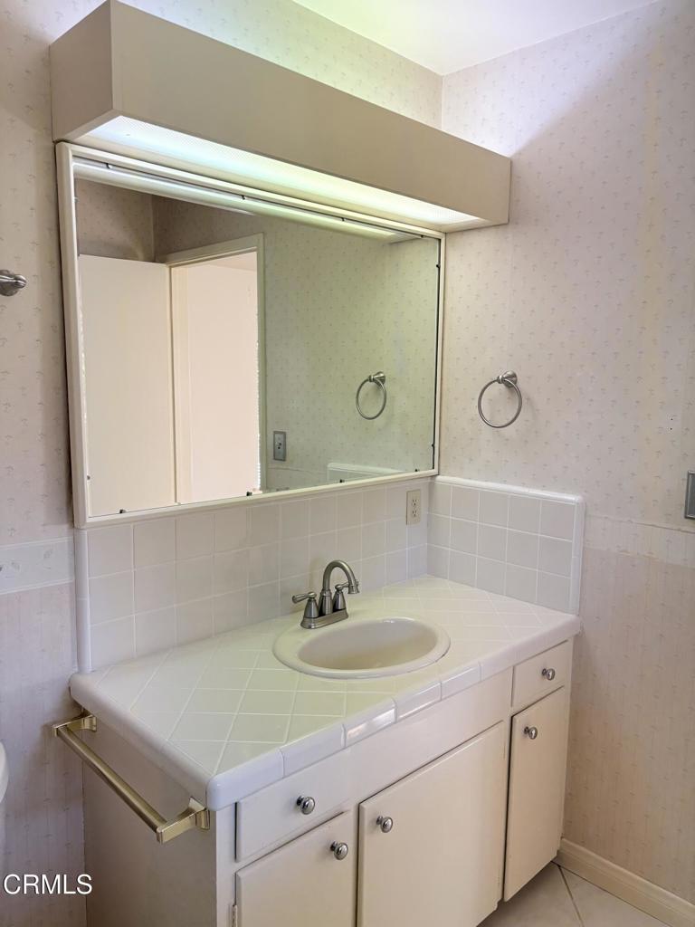 1920 North Altadena Drive Pasadena, CA 91107 - Photo 17 of 25 a bathroom with a sink and a mirror