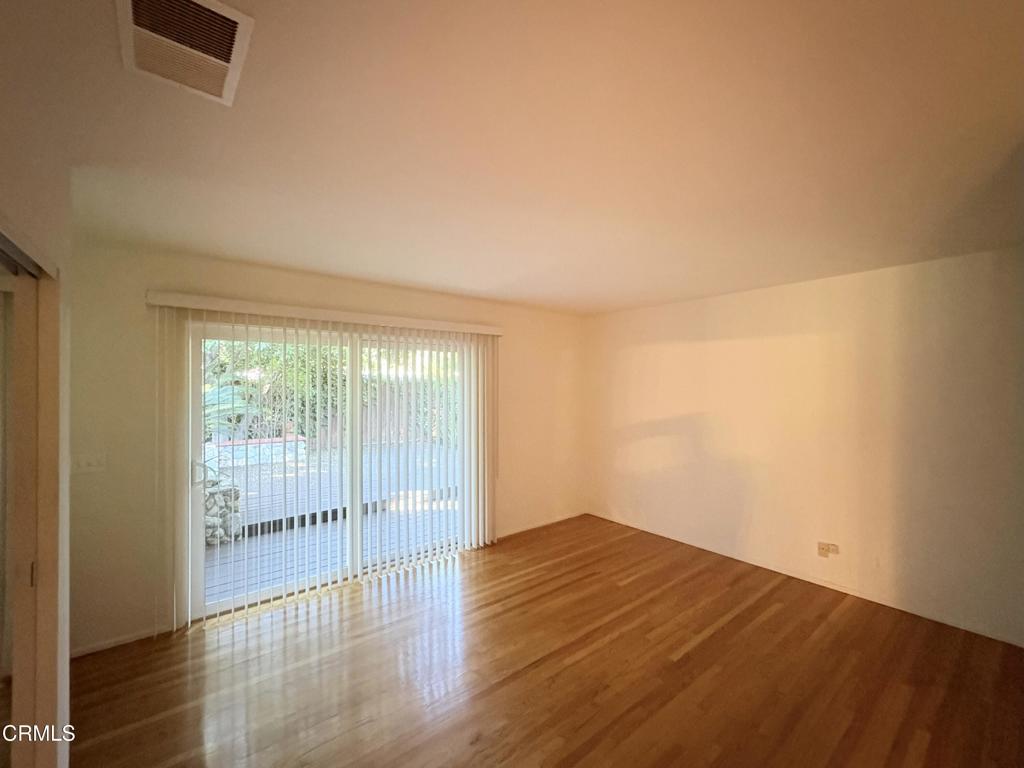 1920 North Altadena Drive Pasadena, CA 91107 - Photo 19 of 25 an empty room with wooden floor and windows