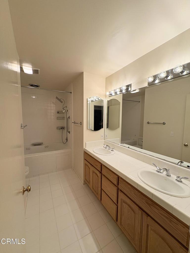 1920 North Altadena Drive Pasadena, CA 91107 - Photo 21 of 25 a spacious bathroom with a tub sink and mirror