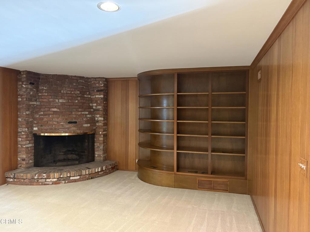 1920 North Altadena Drive Pasadena, CA 91107 - Photo 3 of 25 a view of an empty room with a fireplace and a window