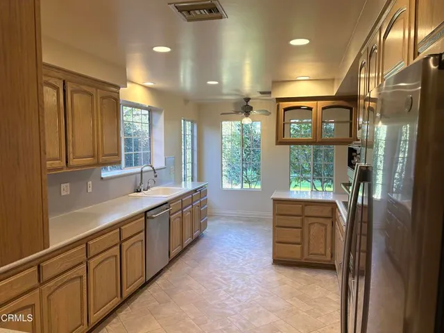 a large bathroom with a large tub and sink