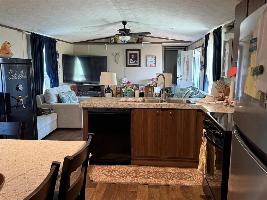 233 Overland Trail Jacksboro, TX 76458 - Photo 9 of 10 a kitchen with a stove and a refrigerator