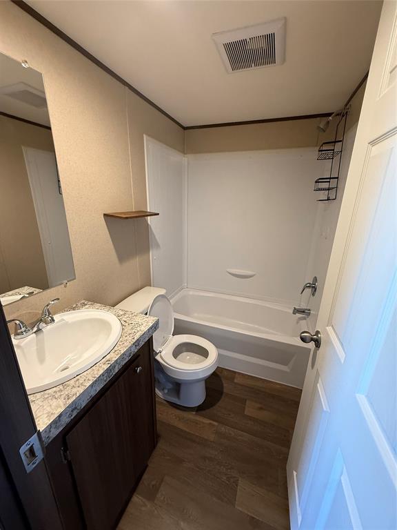 233 Overland Trail Jacksboro, TX 76458 - Photo 6 of 10 a bathroom with a granite countertop sink toilet a mirror and shower