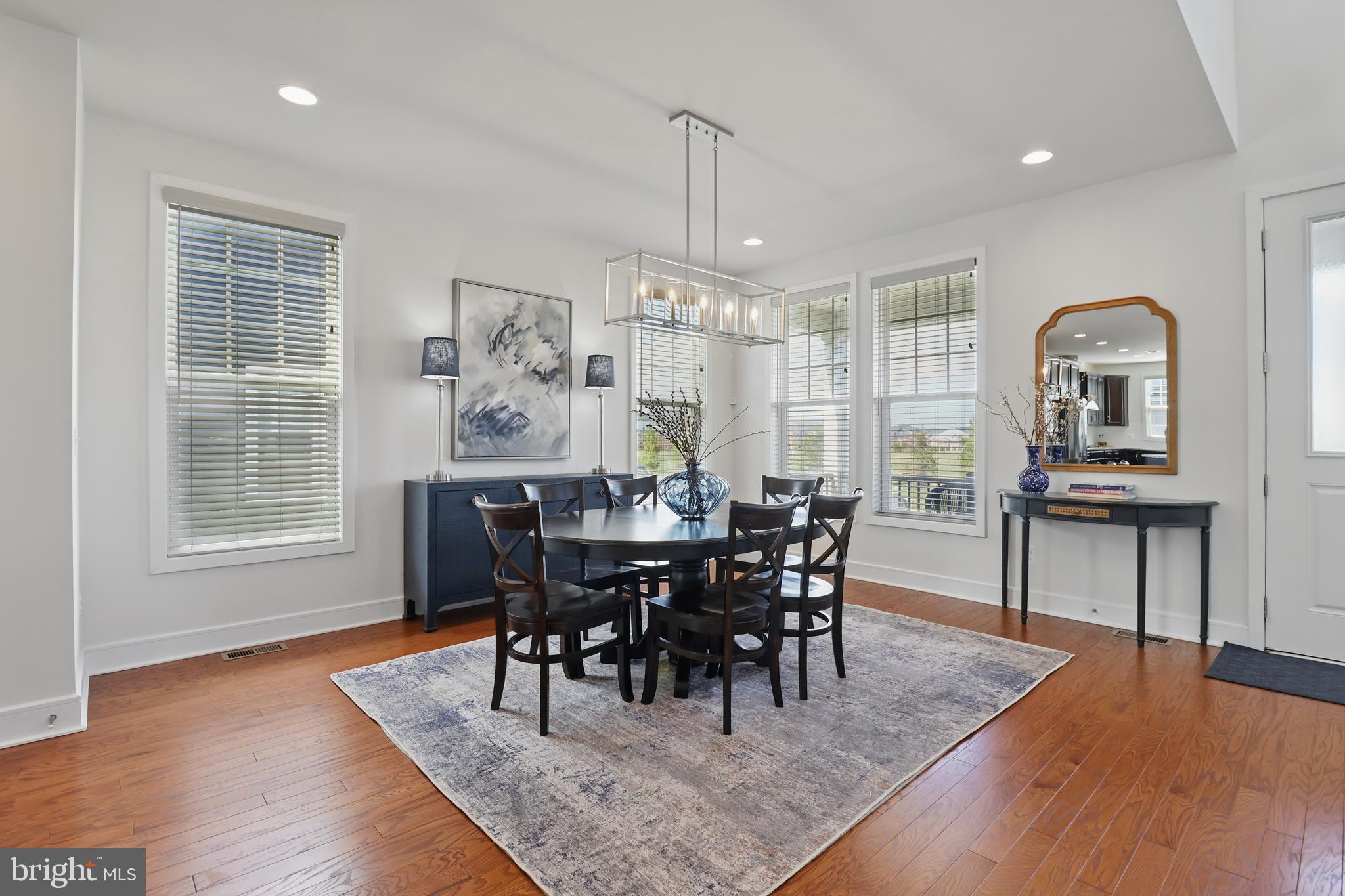 1010 Coubertin Drive Southeast Leesburg, VA 20175 - Photo 13 of 44 a view of a a dining room with furniture window and wooden floor