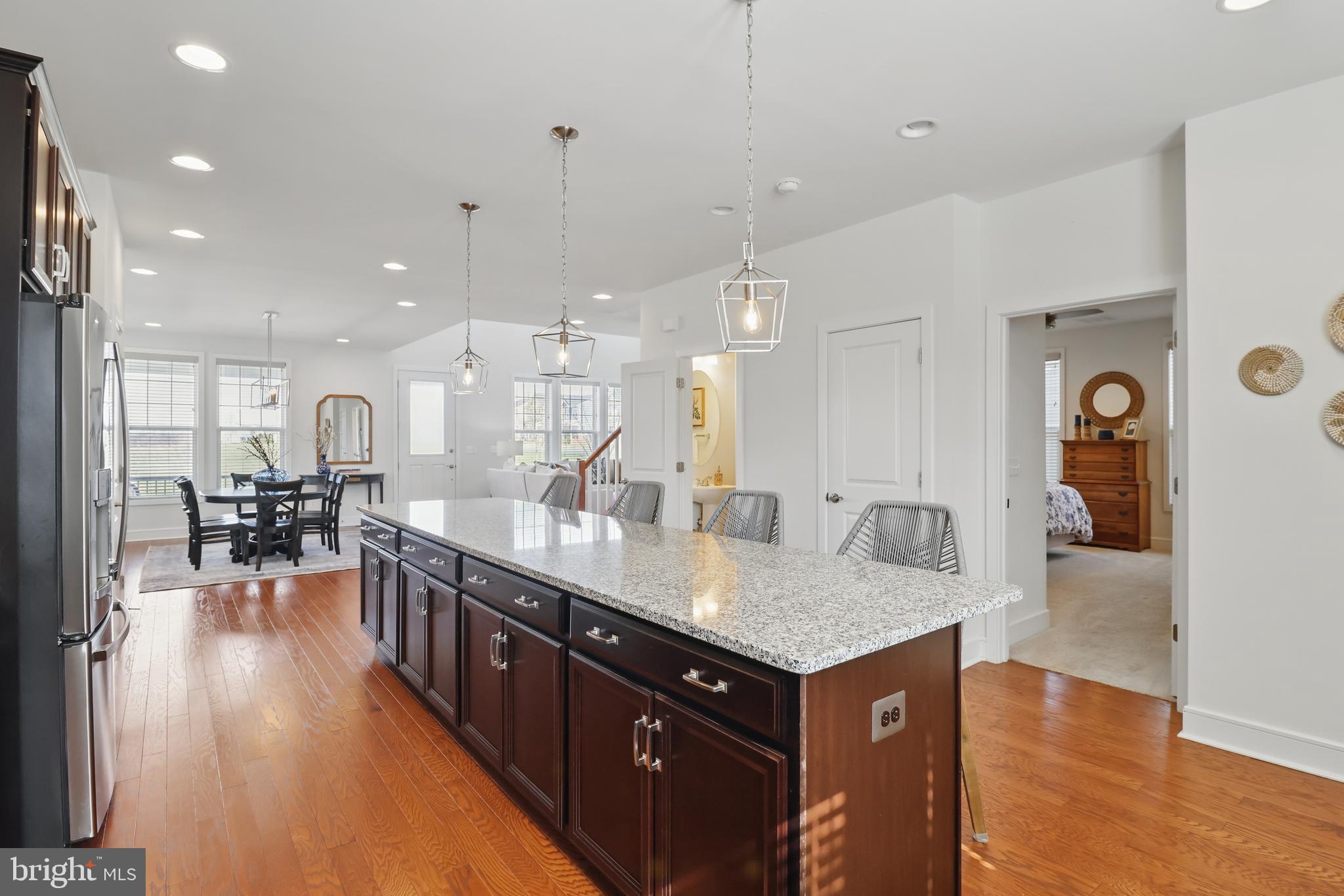 1010 Coubertin Drive Southeast Leesburg, VA 20175 - Photo 16 of 44 a large kitchen with kitchen island a large island in it