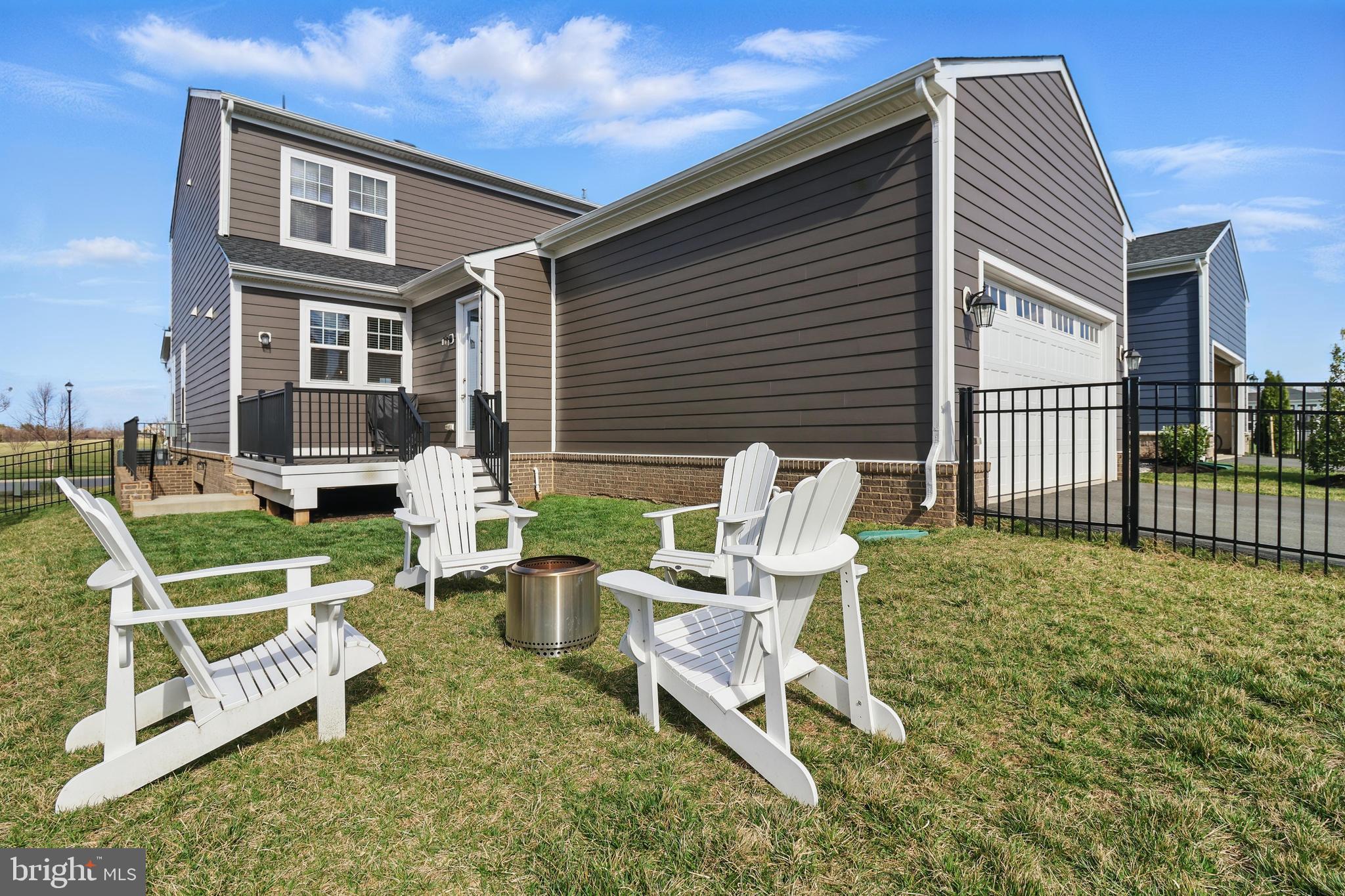 1010 Coubertin Drive Southeast Leesburg, VA 20175 - Photo 21 of 44 a view of a chair and table in backyard of the house