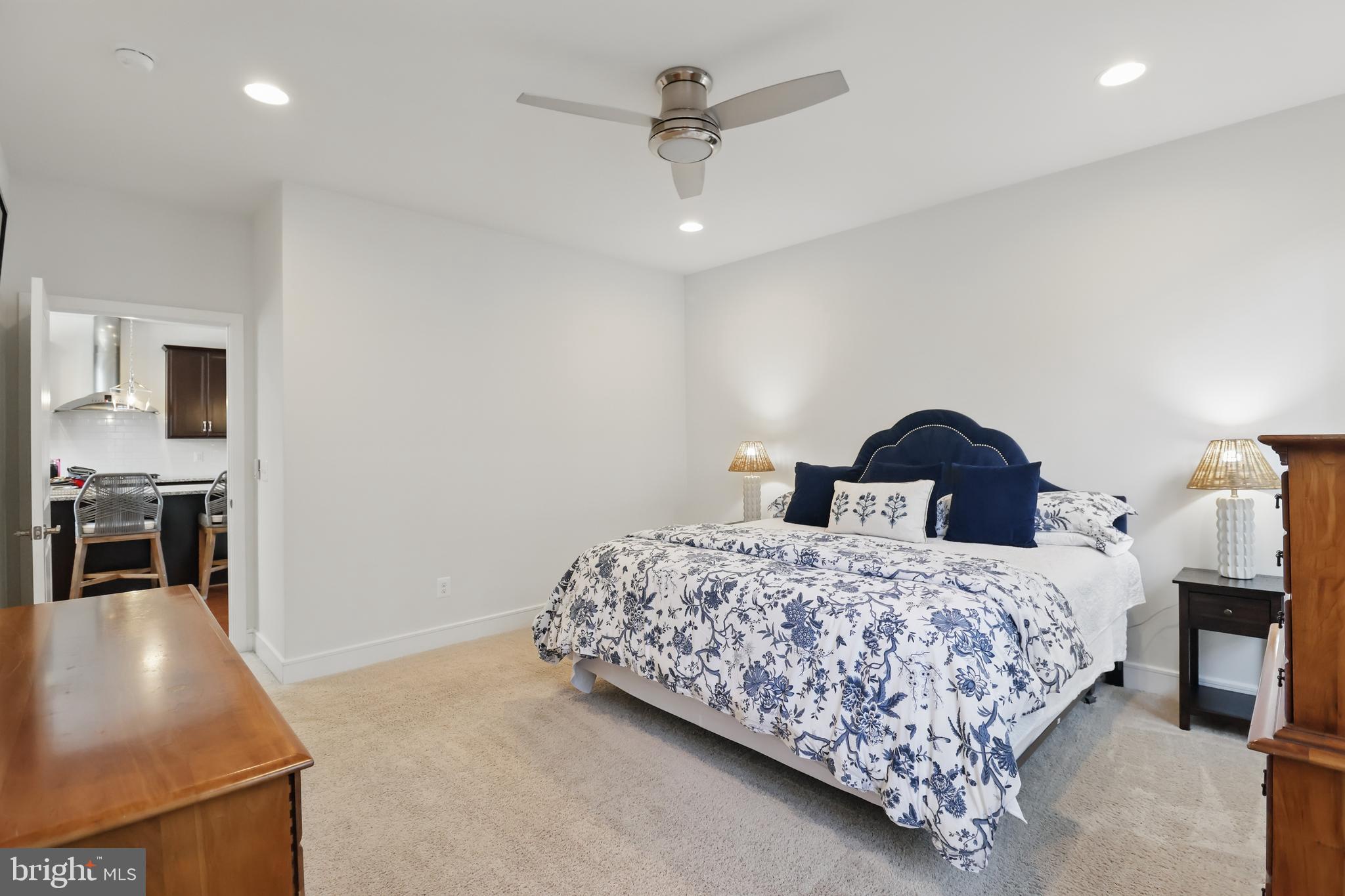 1010 Coubertin Drive Southeast Leesburg, VA 20175 - Photo 23 of 44 a bedroom with a bed and a chandelier