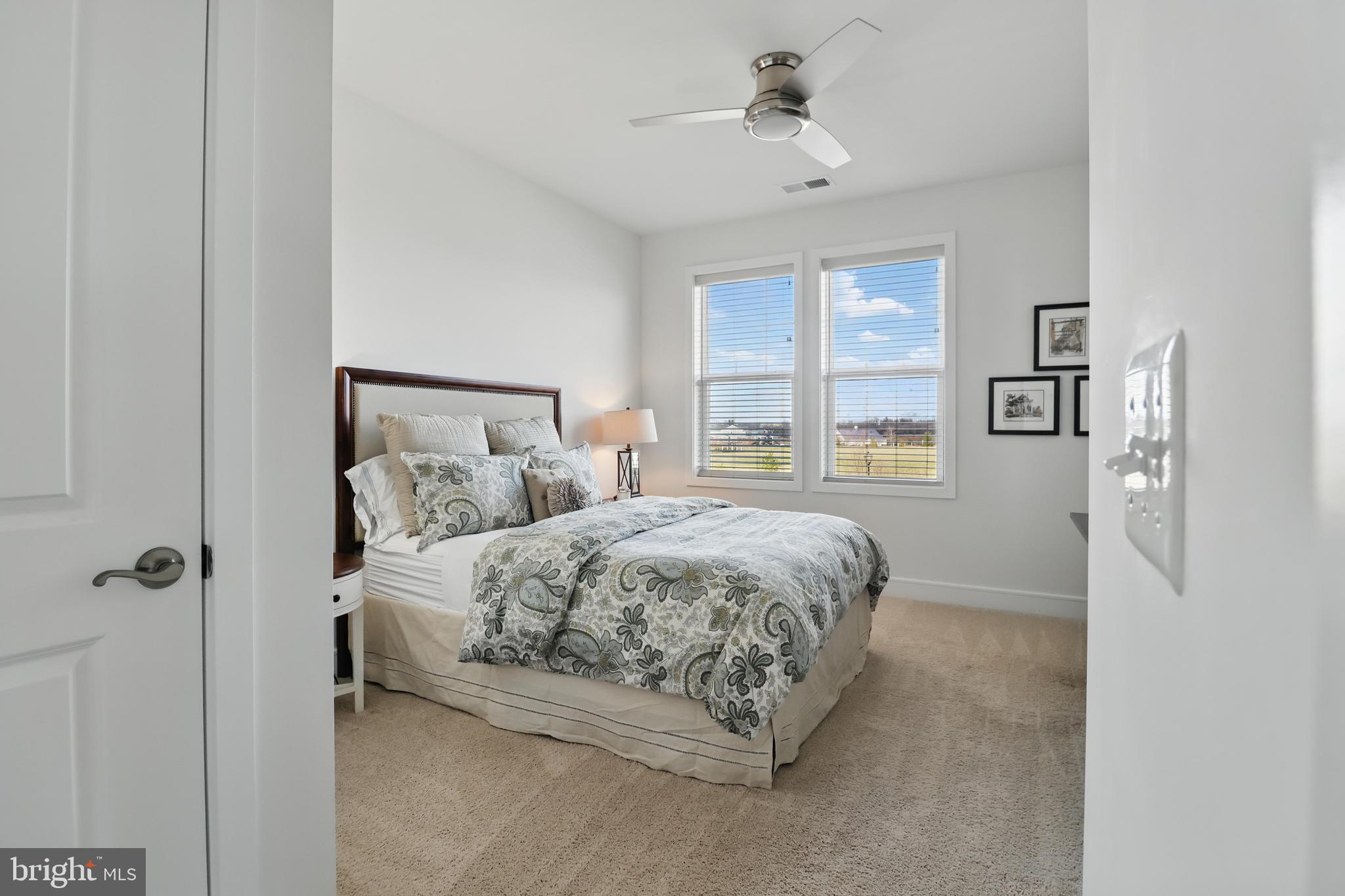 1010 Coubertin Drive Southeast Leesburg, VA 20175 - Photo 30 of 44 a bedroom with a bed and a window