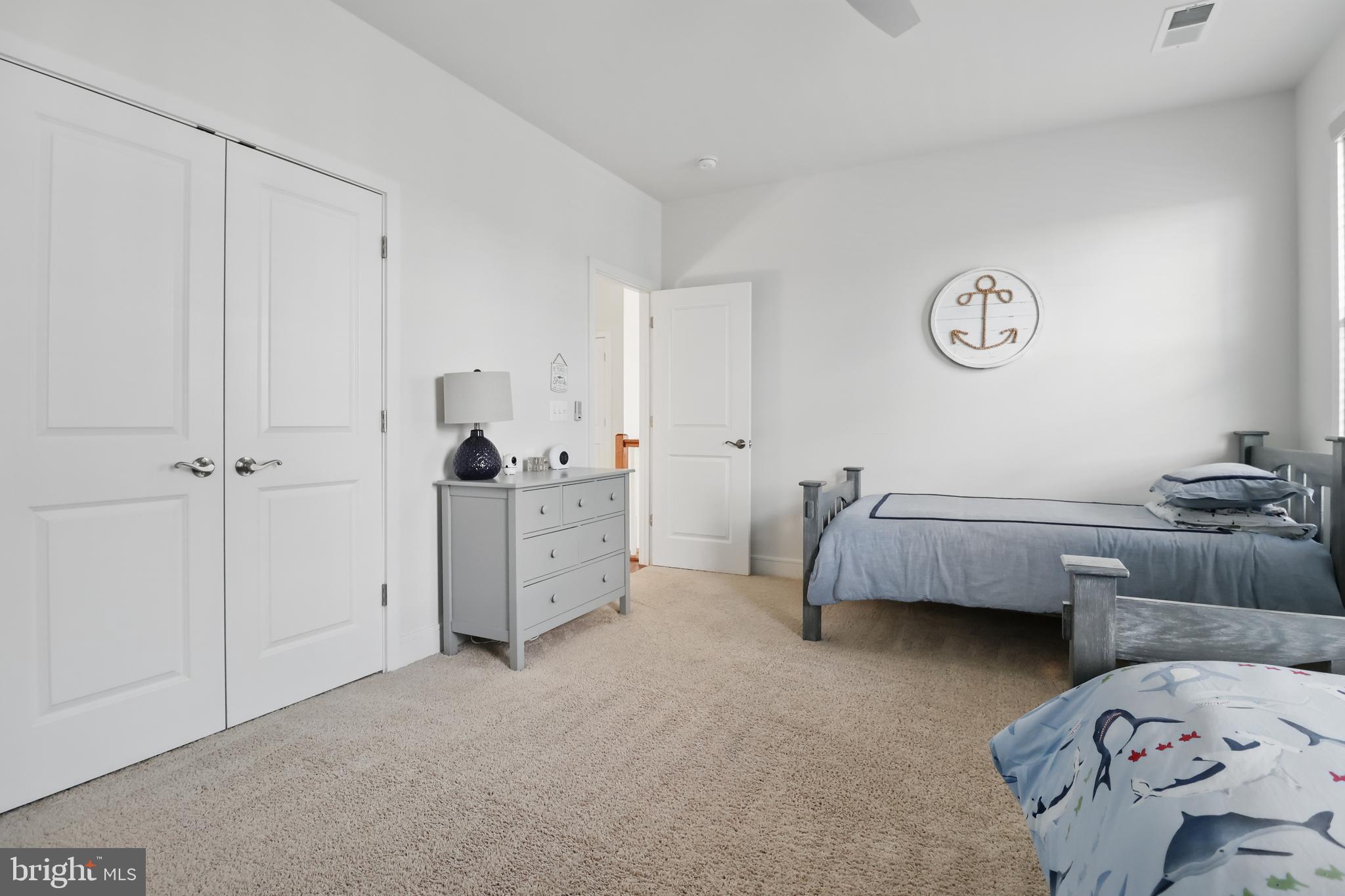 1010 Coubertin Drive Southeast Leesburg, VA 20175 - Photo 34 of 44 a bedroom with bed and a closet